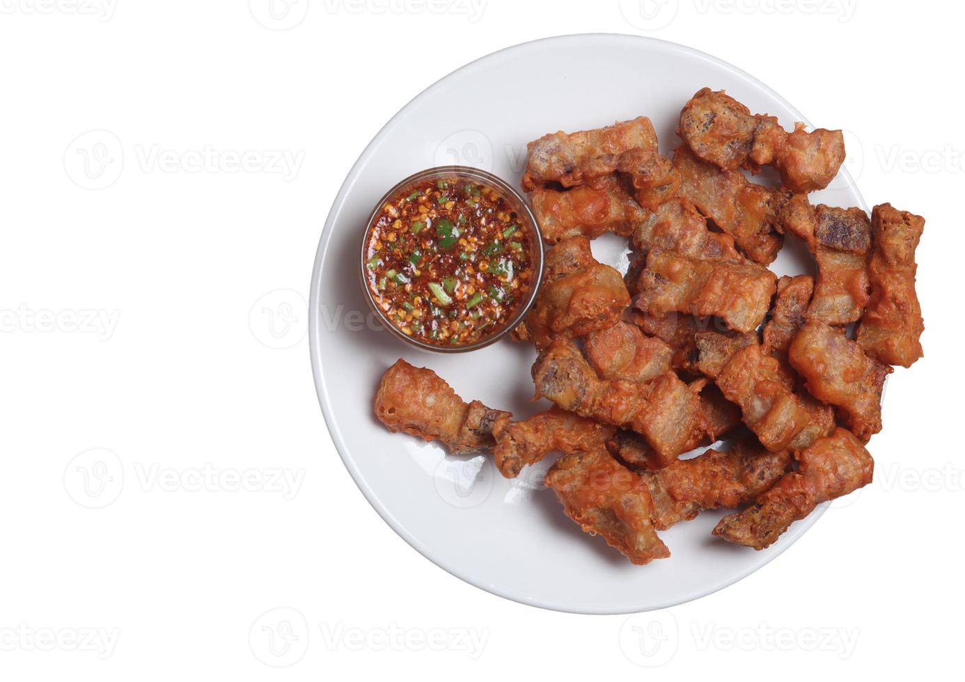 Fried pork with fish sauce on a white background photo