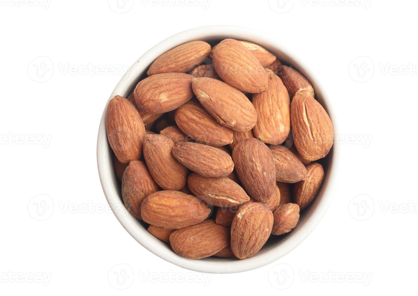 Almonds in a cup on a white background photo