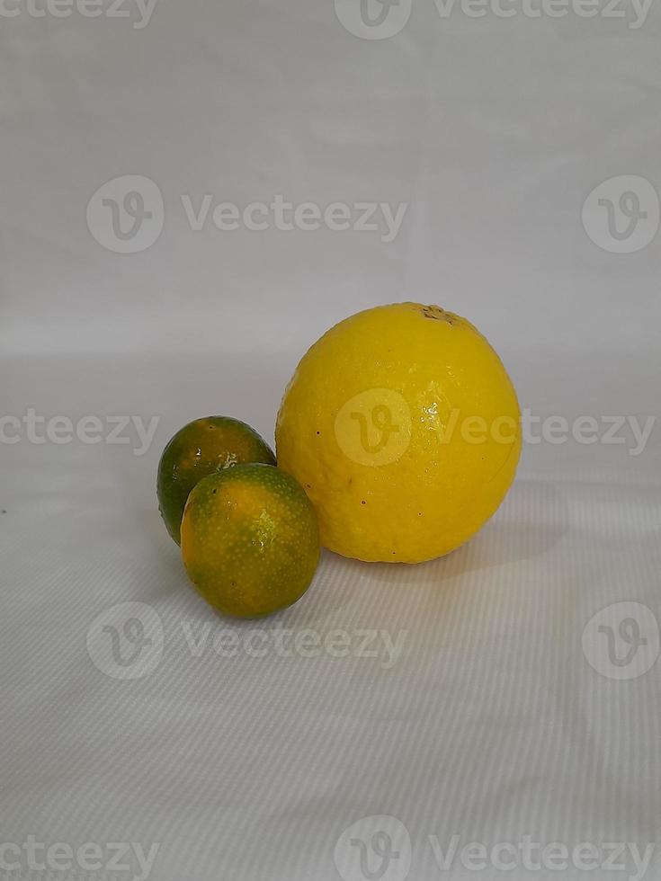 Fresh lemon and lime fruit on white background, Juicy lemon. photo