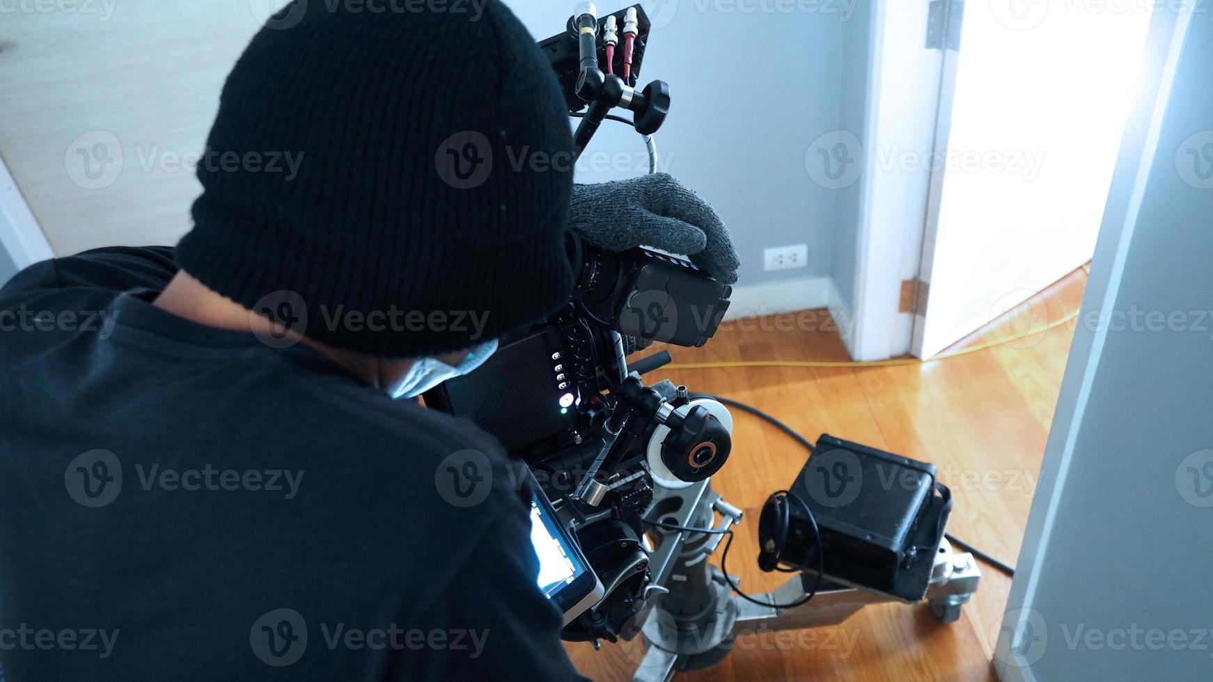 Behind the scenes of Videographer or photographer shooting video or movie production photo