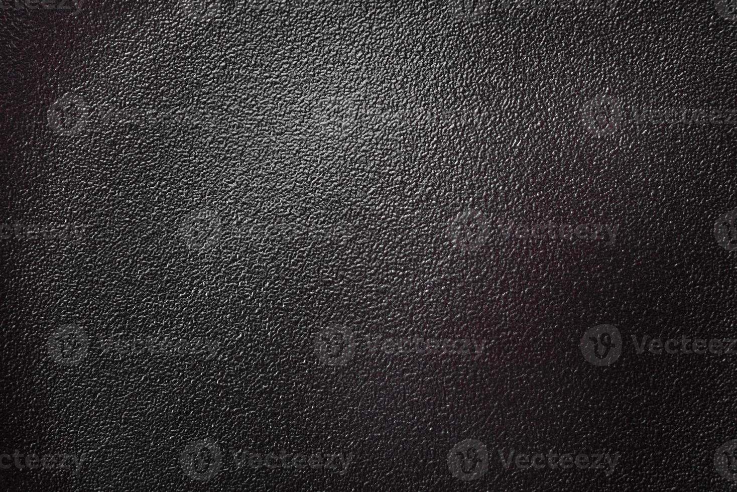 Empty beautiful black ceramic plate on a dark concrete background photo