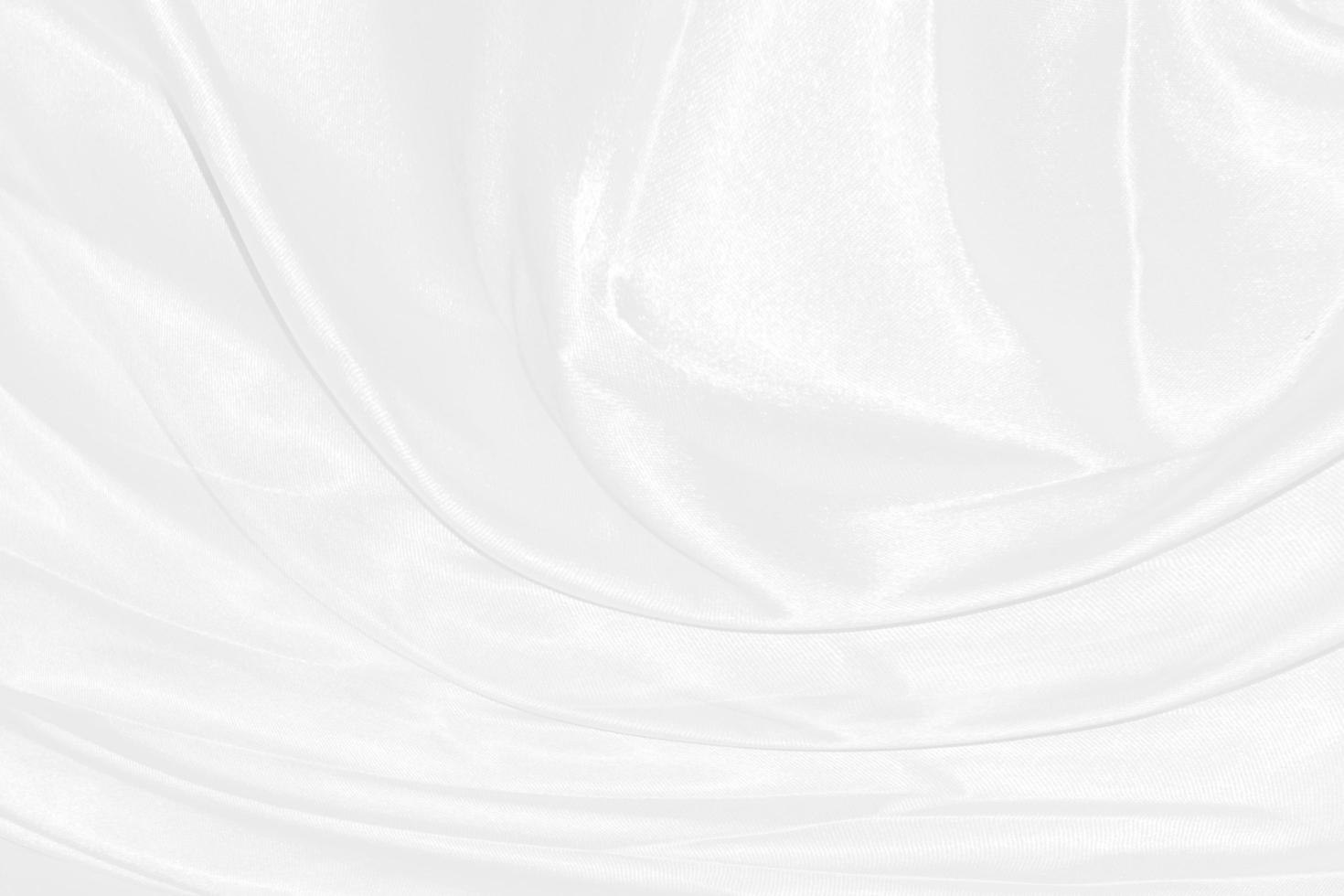 Smooth elegant white silk or satin luxury cloth texture can use as wedding background. Luxurious background design photo