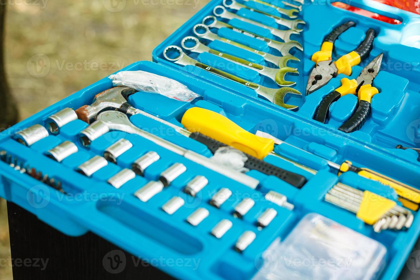 background of the interior of a toolbox filled with lots of tools photo