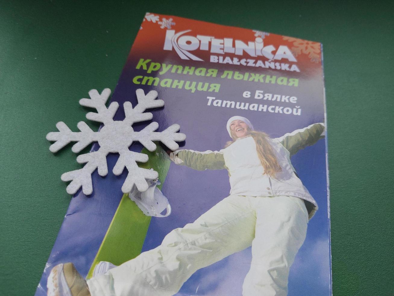 KYIV, UKRAINE - JANUARY 4, 2023 Catalogs and promotional offers of the resort Zakopane, Poland photo