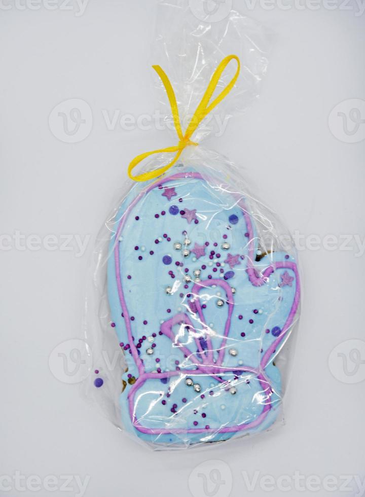 Gingerbread cakes for the new year on a white background. Green and blue sweet gingerbread cakes with icing. photo