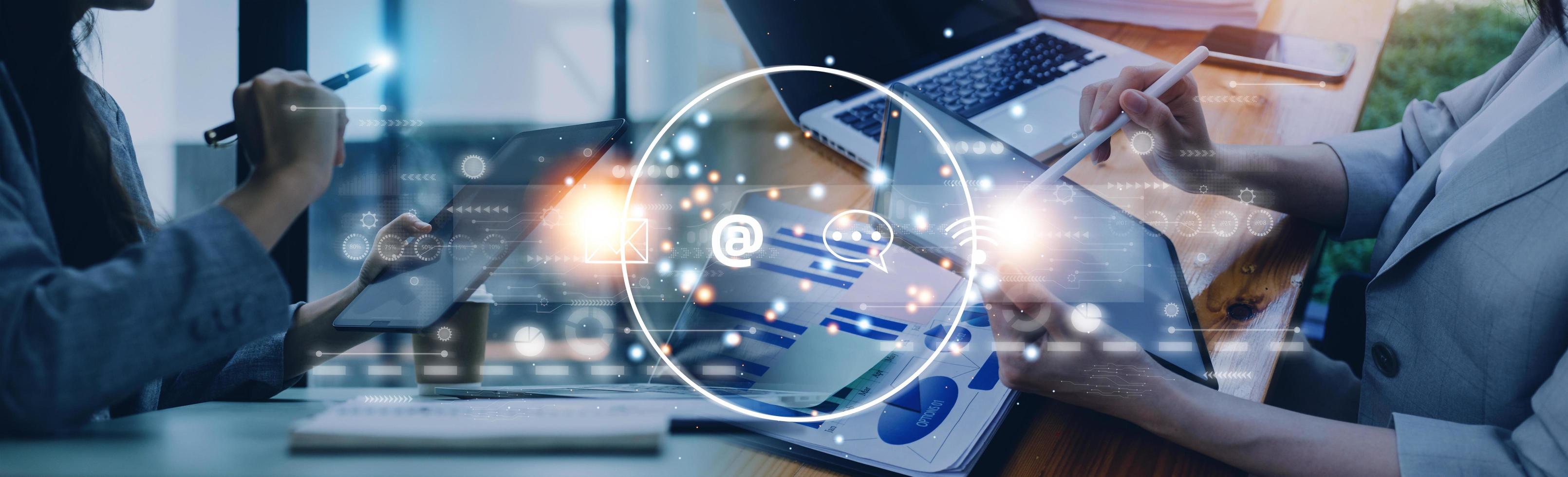 Contact us or Customer support hotline people connect. Businessman using a laptop and touching on virtual screen contact icons  email, address, live chat, internet wifi . photo