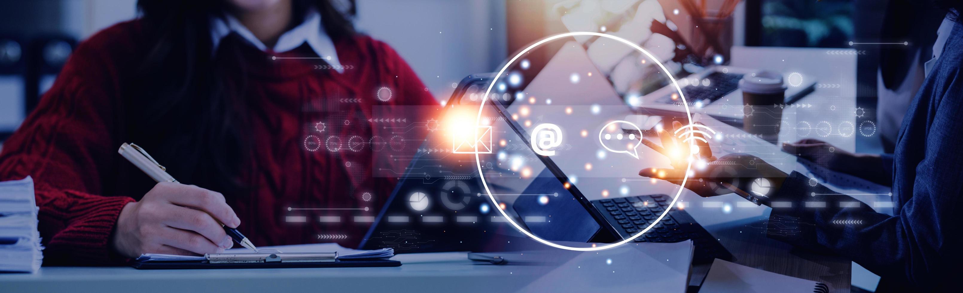 Contact us or Customer support hotline people connect. Businessman using a laptop and touching on virtual screen contact icons  email, address, live chat, internet wifi . photo
