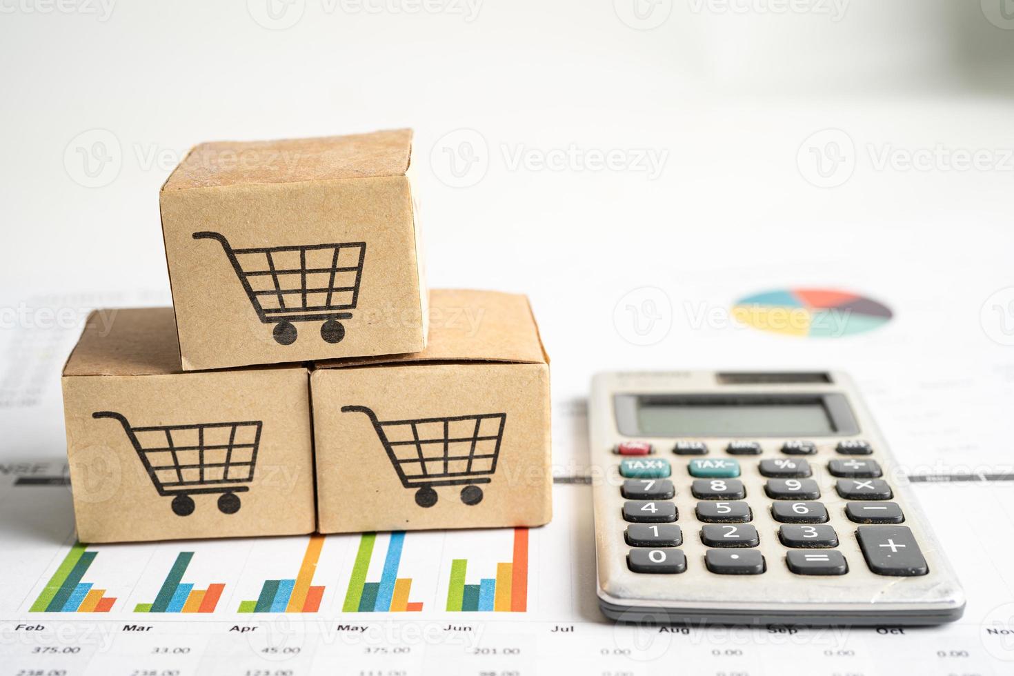 Shopping cart logo on box on graph background. Banking Account, Investment Analytic research data economy, trading, Business import export transportation online company concept. photo