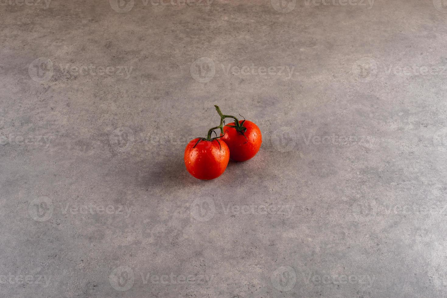 The popular fruit of America. Tomatoes on the cement background. photo