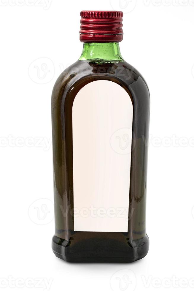 Closed full cognac bottle with label isolated on white background photo