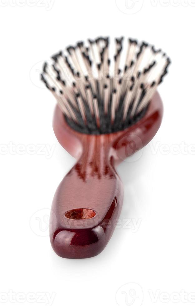 Wooden hairbrush on white background. photo