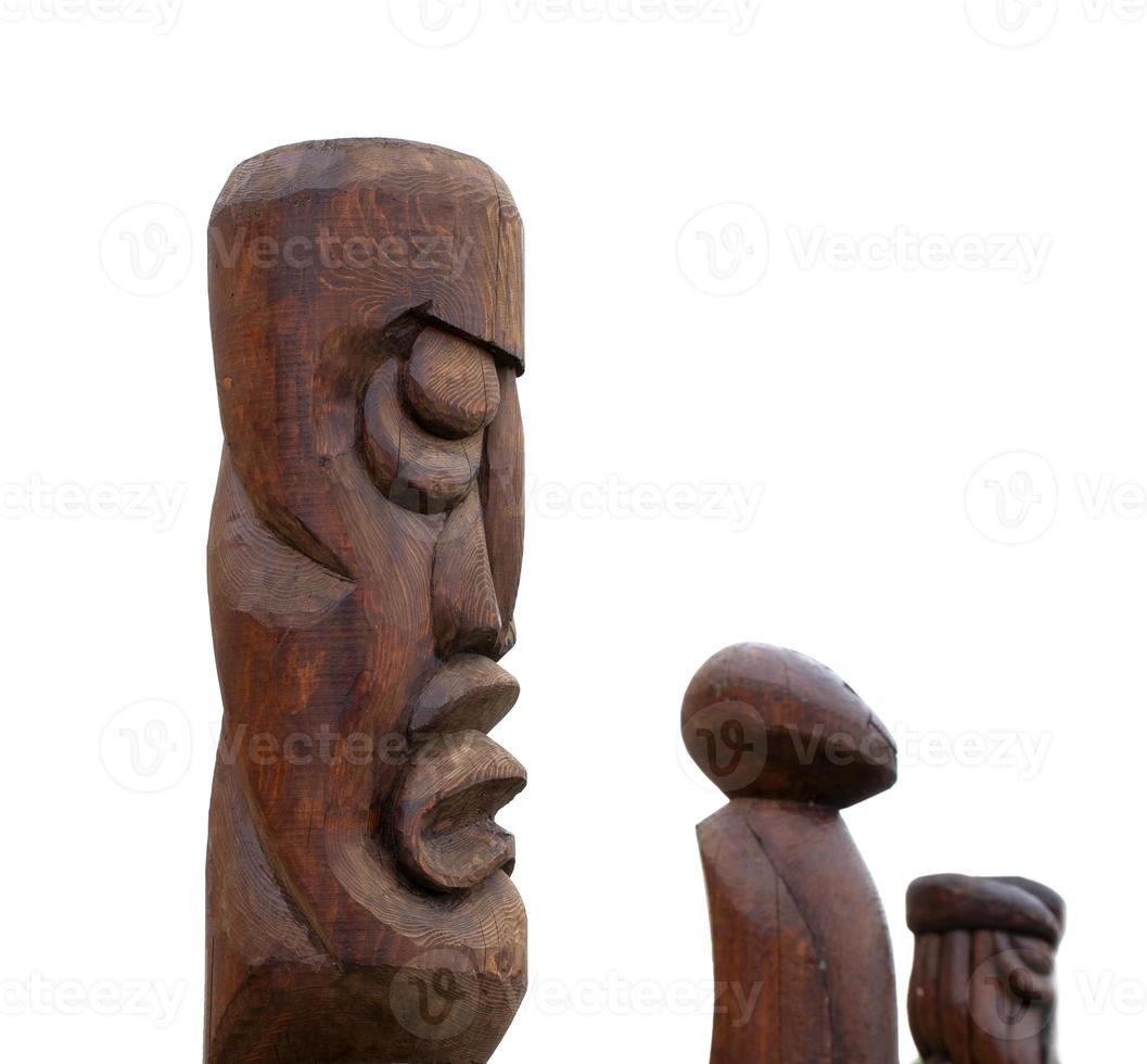 wooden idol statue of koryak on a white background photo