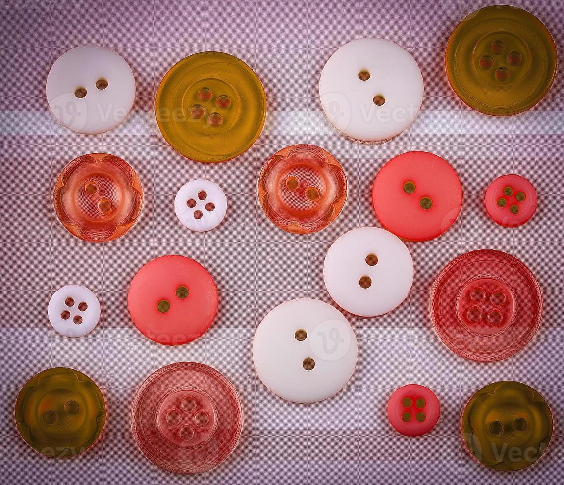 Colored buttons of different sizes on the surface photo