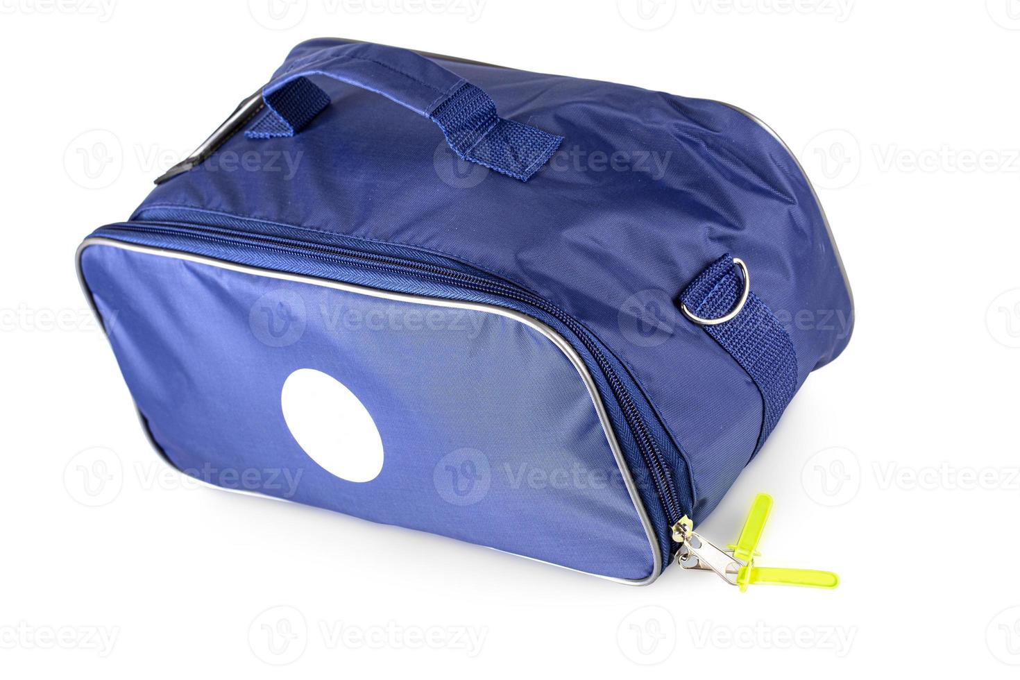 blue medical bag with red cross isolated on white photo