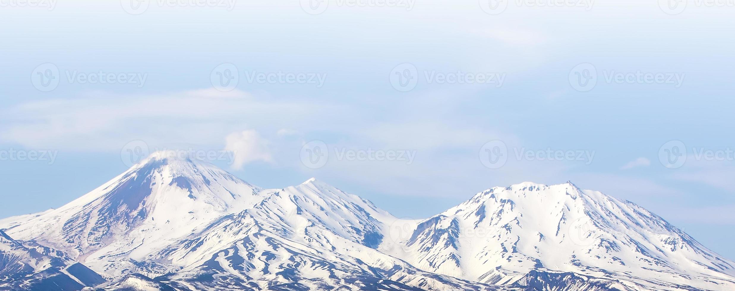 Avachinsky volcano towers over the city of Petropavlovsk-Kamchatsky on the Kamchatka Peninsula photo