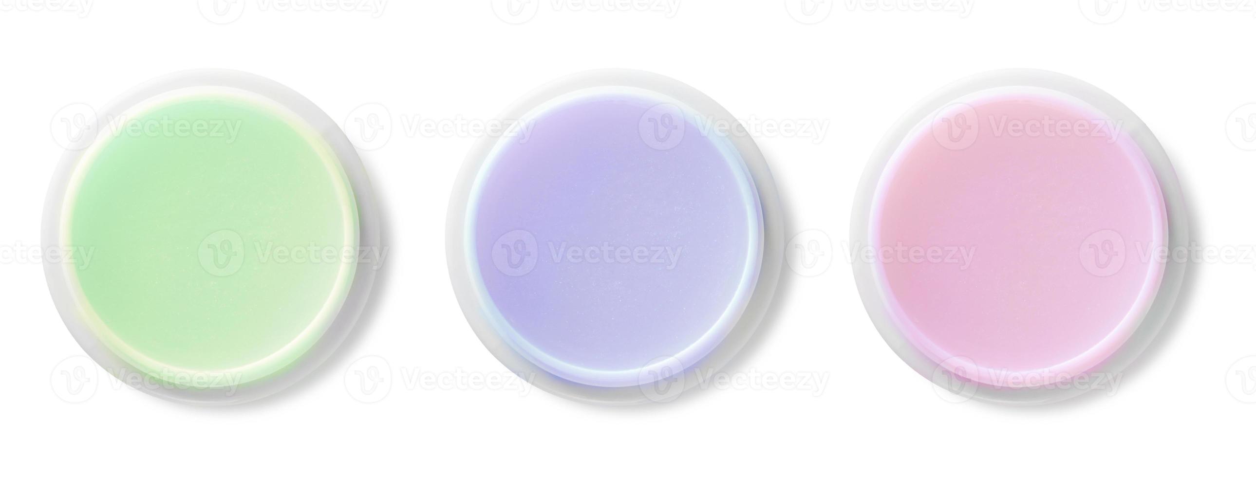 Jar with colored body cream on white background photo