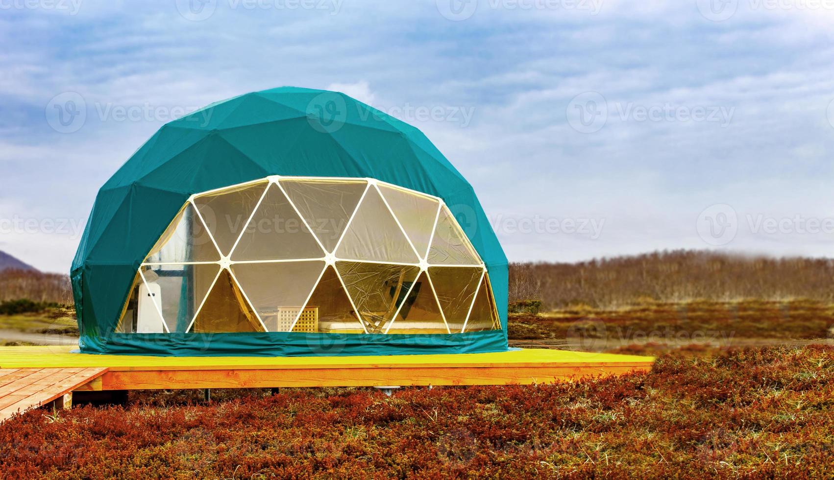 Green geodome tent. Cozy, camping, glamping, holiday, vacation lifestyle concept. photo