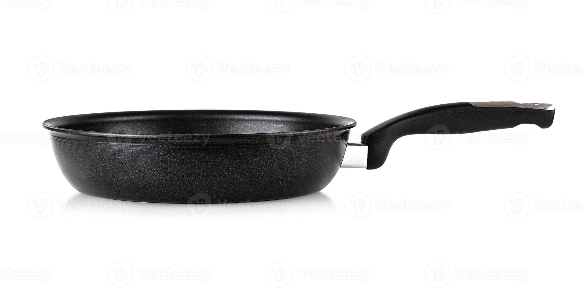 The Frying pan with black marble coating isolated on white background photo