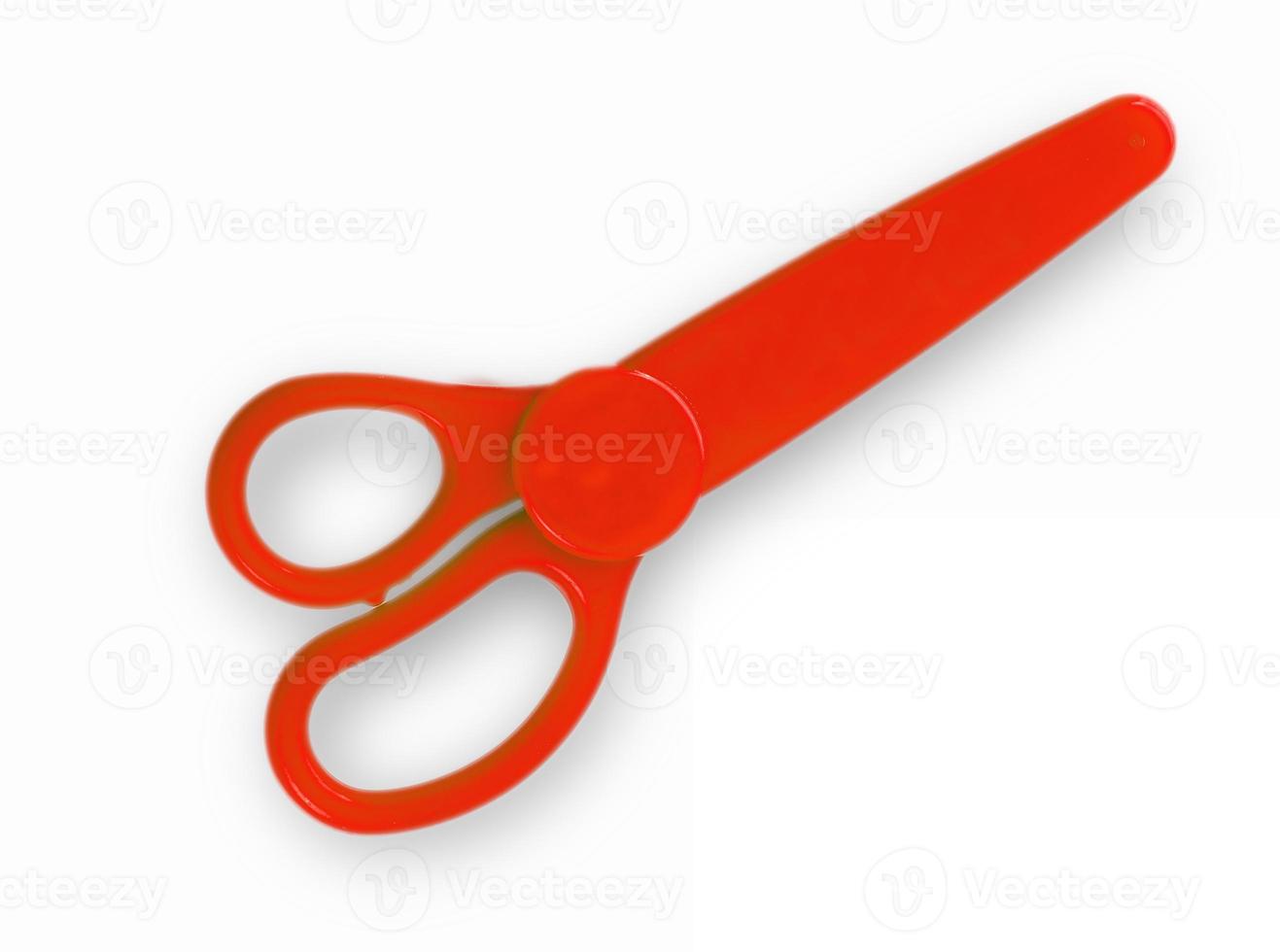 red baby scissors cut out on a white background. View from above photo