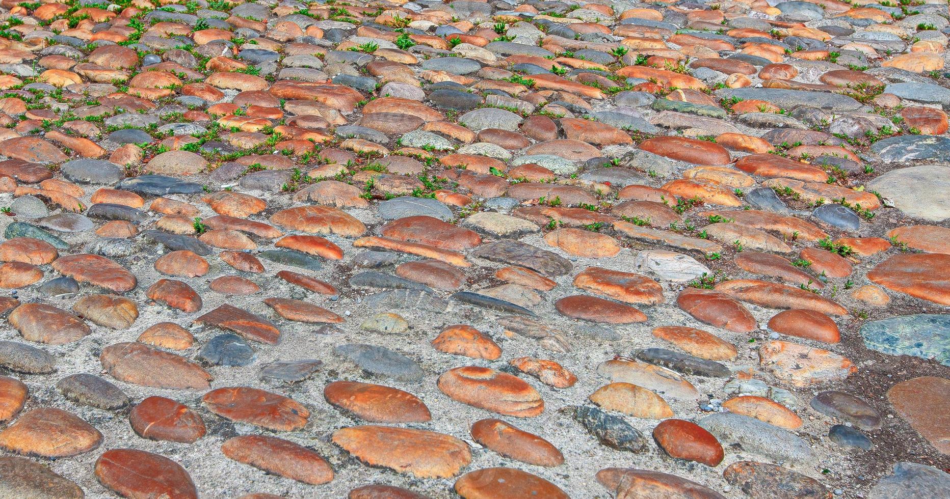 Cobbled, ancient city of stone road. Stone road texture photo