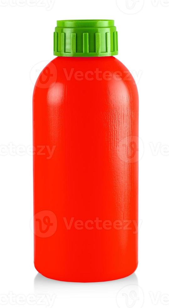 The close up red plastic bottle with green cap on white photo
