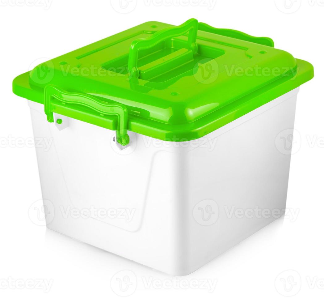 White plastic box with green cover on white background photo