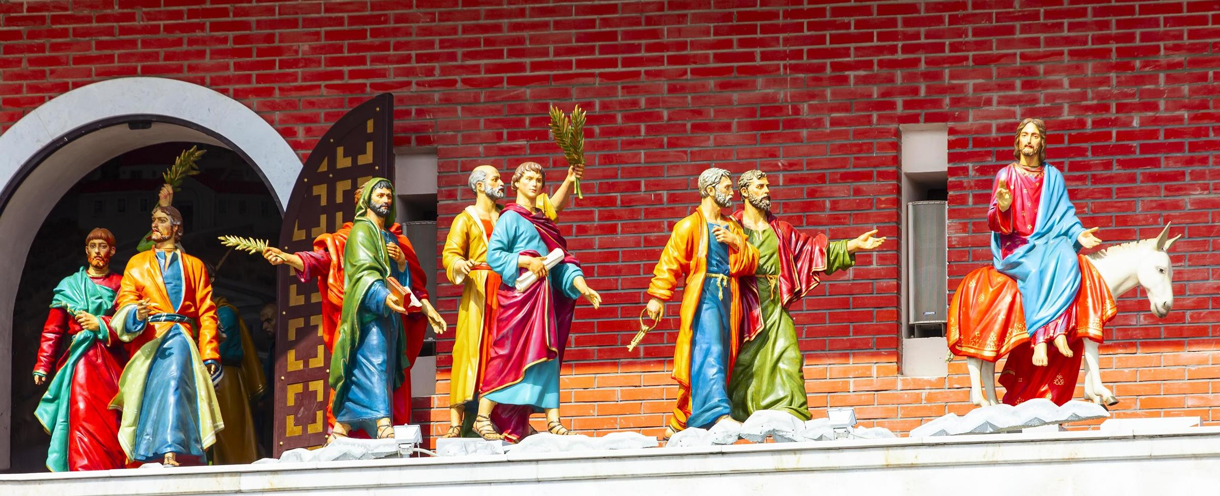 12 apostles clock and Monument to Holy Patriarch Alexy II in the city center photo