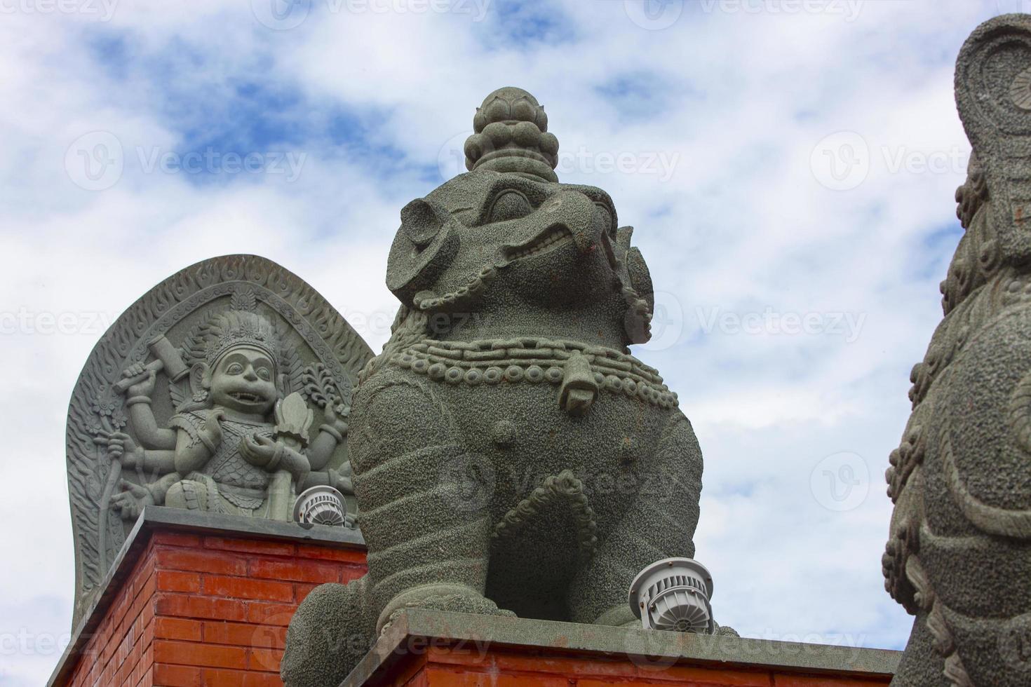 statue on the stairs in Chinese temple. Selective focus photo