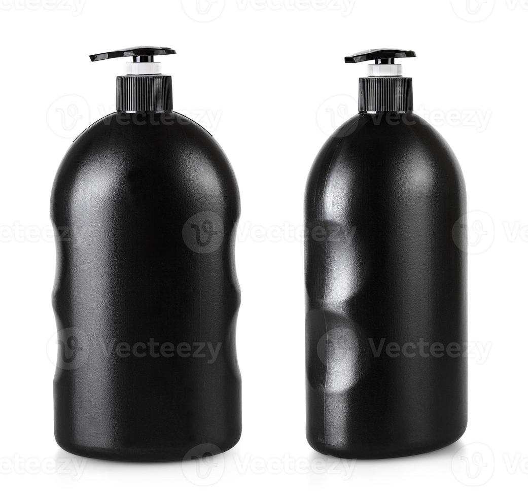 botella cosmética negra con bomba aislada sobre fondo blanco foto