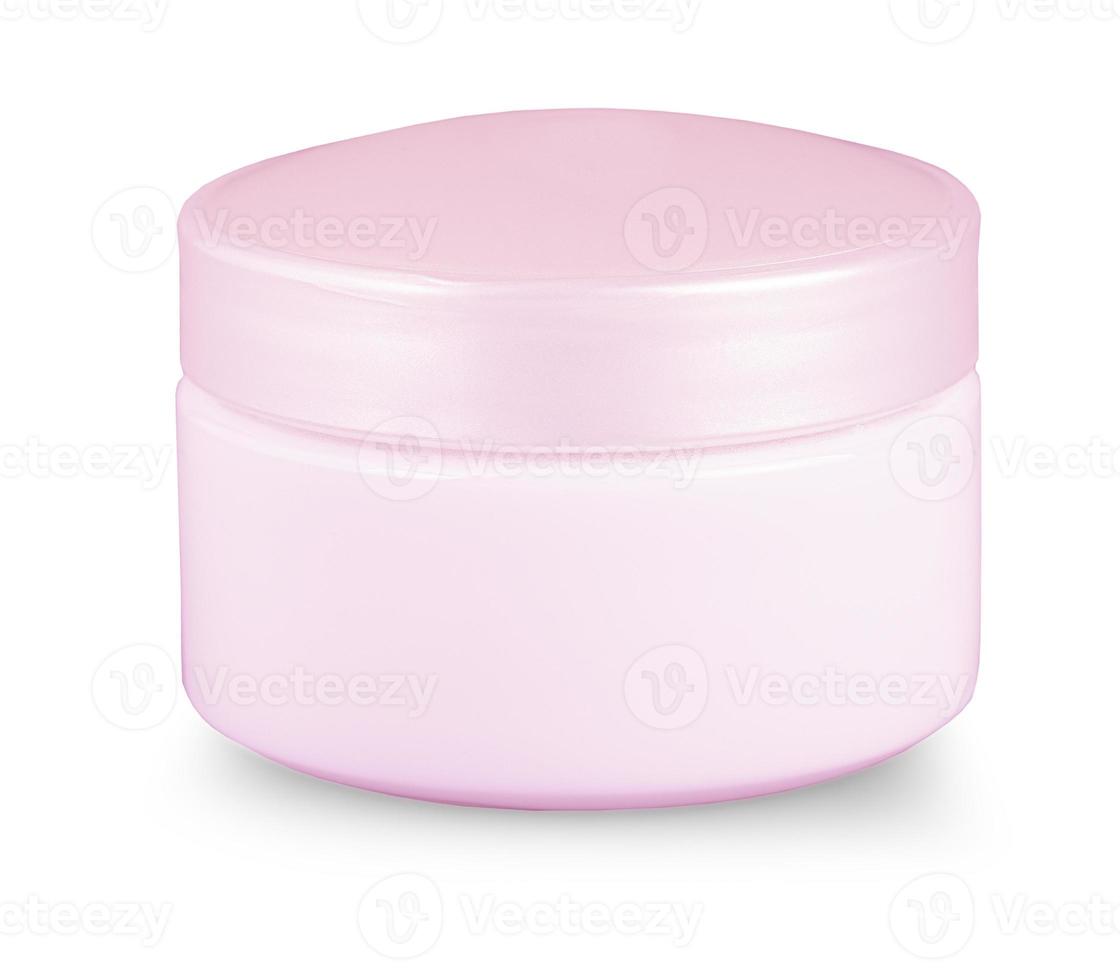 Tarro rosa con crema cosmética aislado sobre fondo blanco. foto