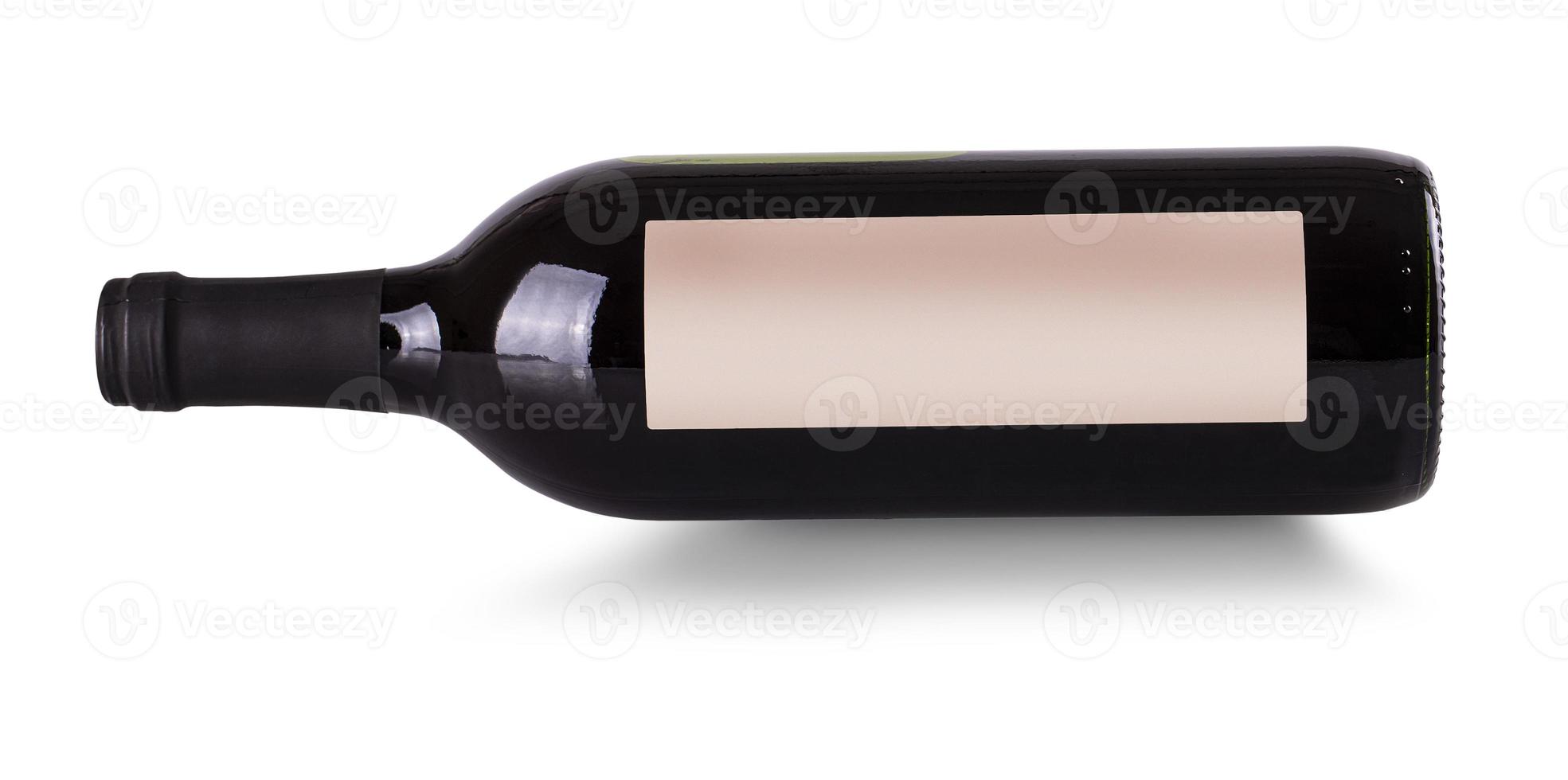 close up bottle of red wine on the side with label isolated on white photo