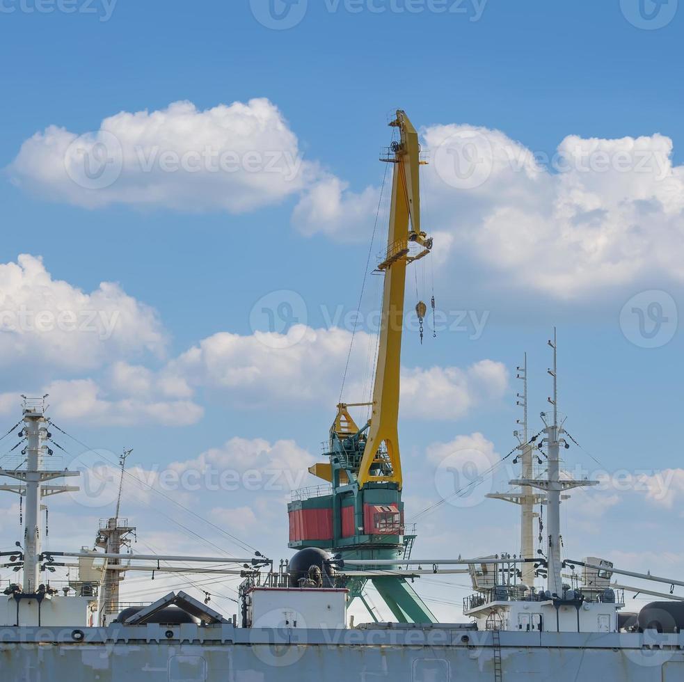The vessel and the crane in a bay on Kamchatka photo
