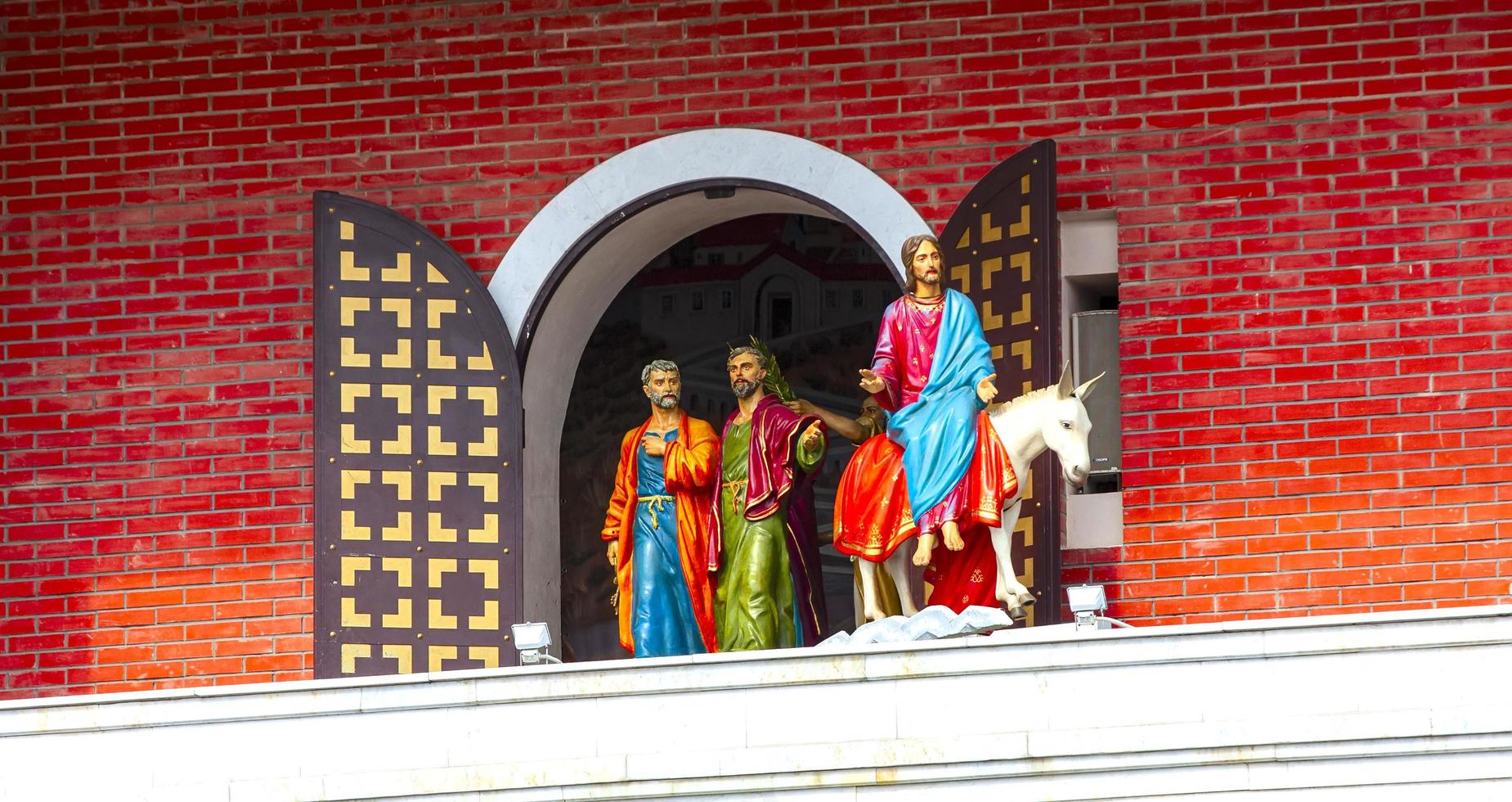 12 apostles clock and Monument to Holy Patriarch Alexy II in the city center photo