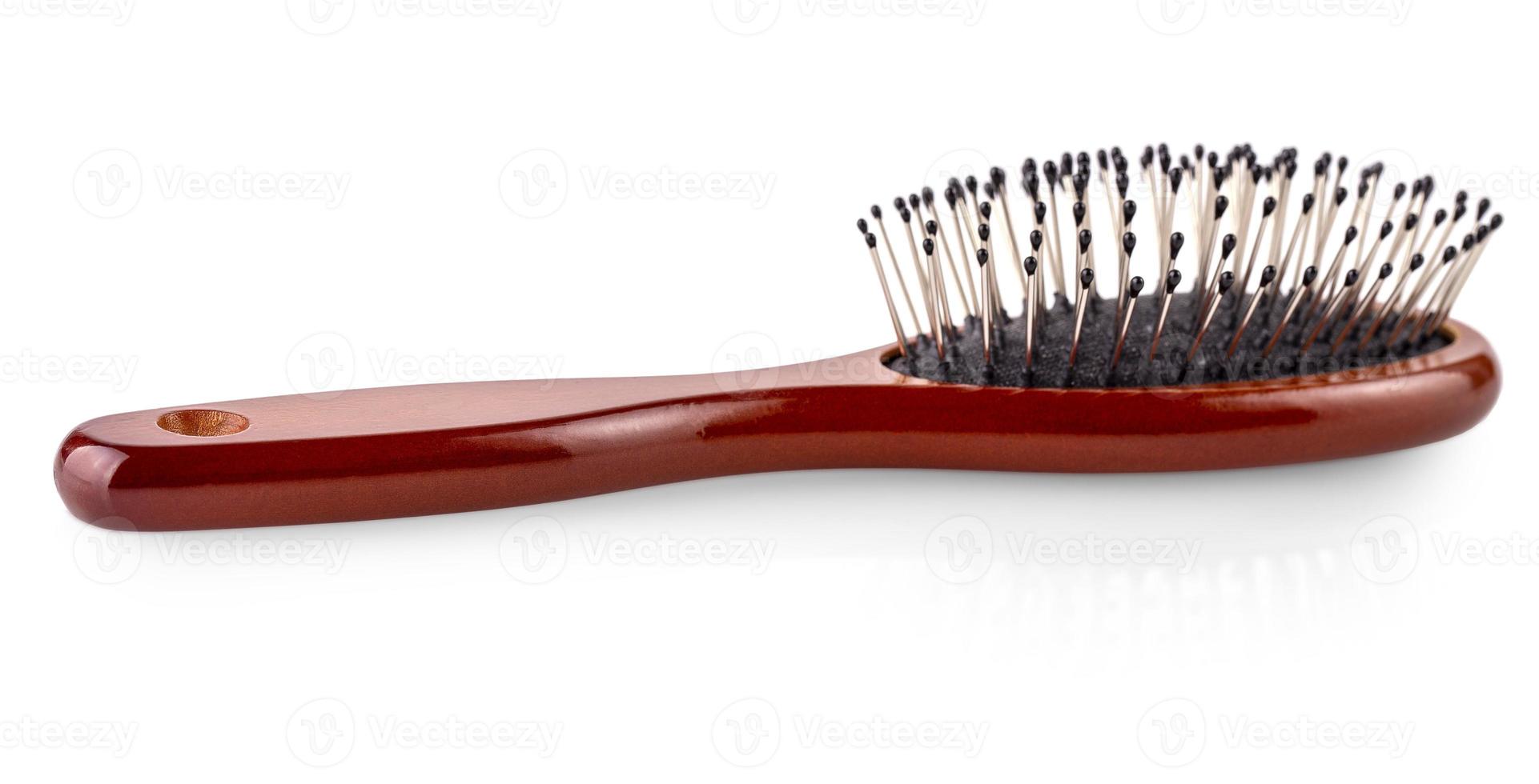 Wooden hairbrush on white background. photo