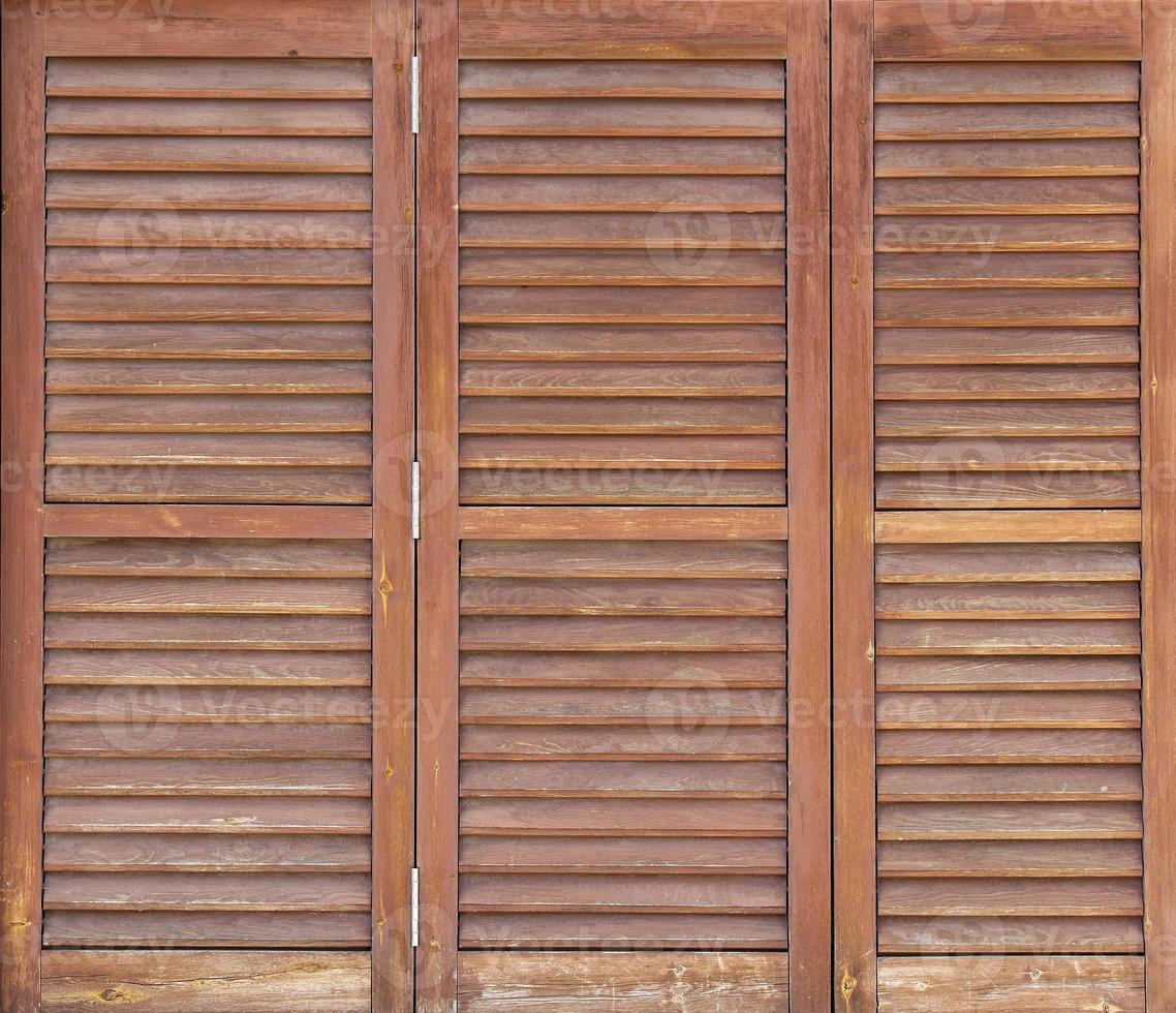 Old wooden windows frame on stone wall in Spain. Close up photo