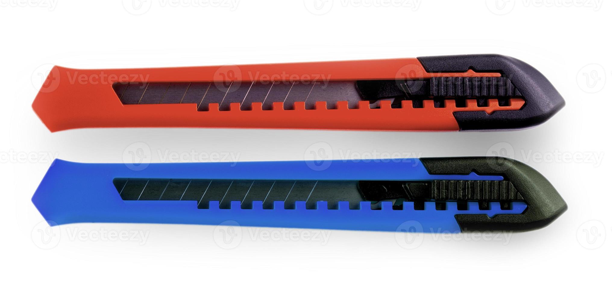 Blue and red paper cutters with closed blade photo