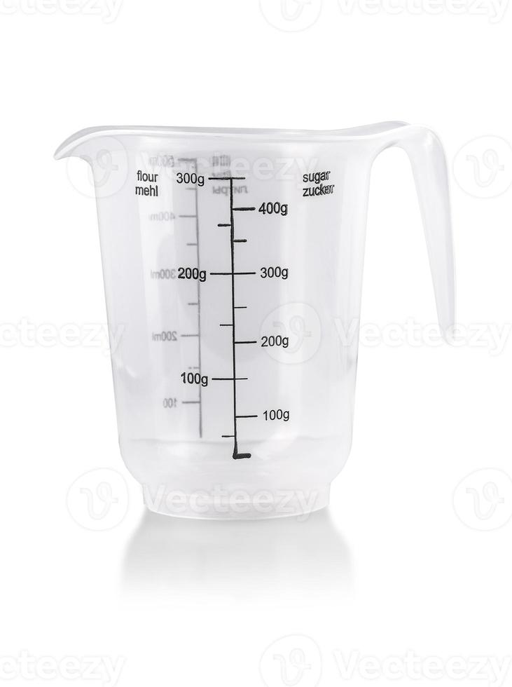 Plastic Transparent kitchen measuring cup isolated on white photo