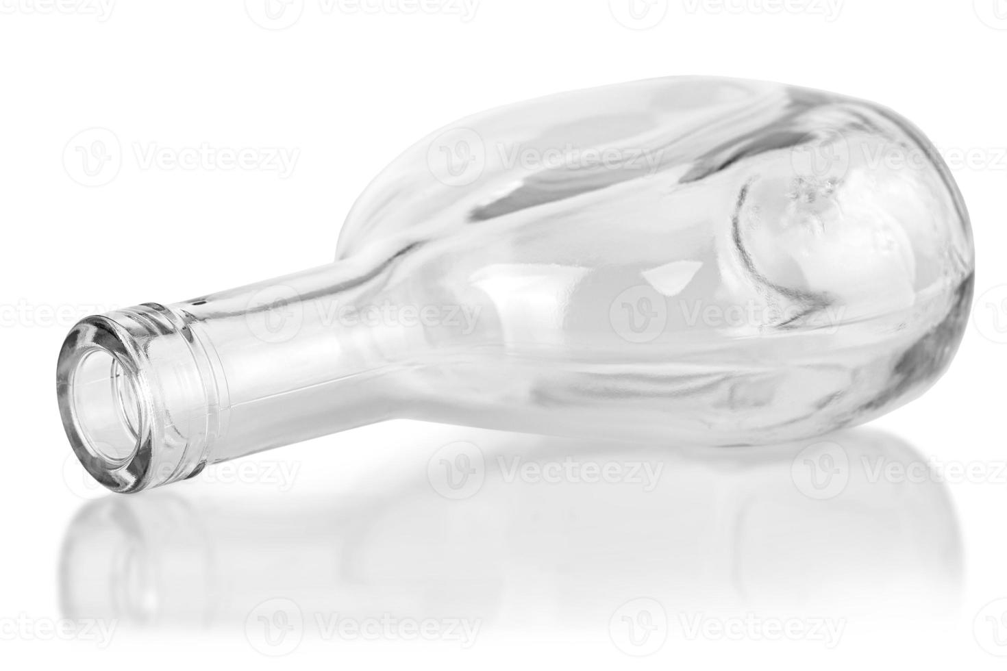 empty clear cognac bottle isolated on white background photo