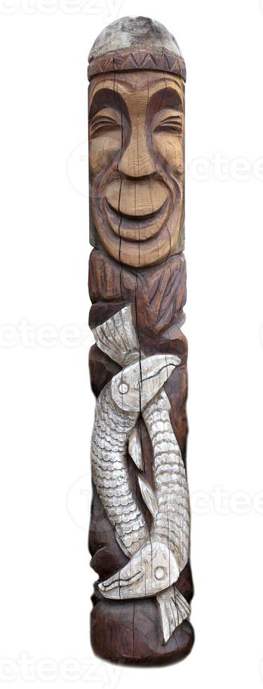 wooden idol statue of koryak on a white background photo