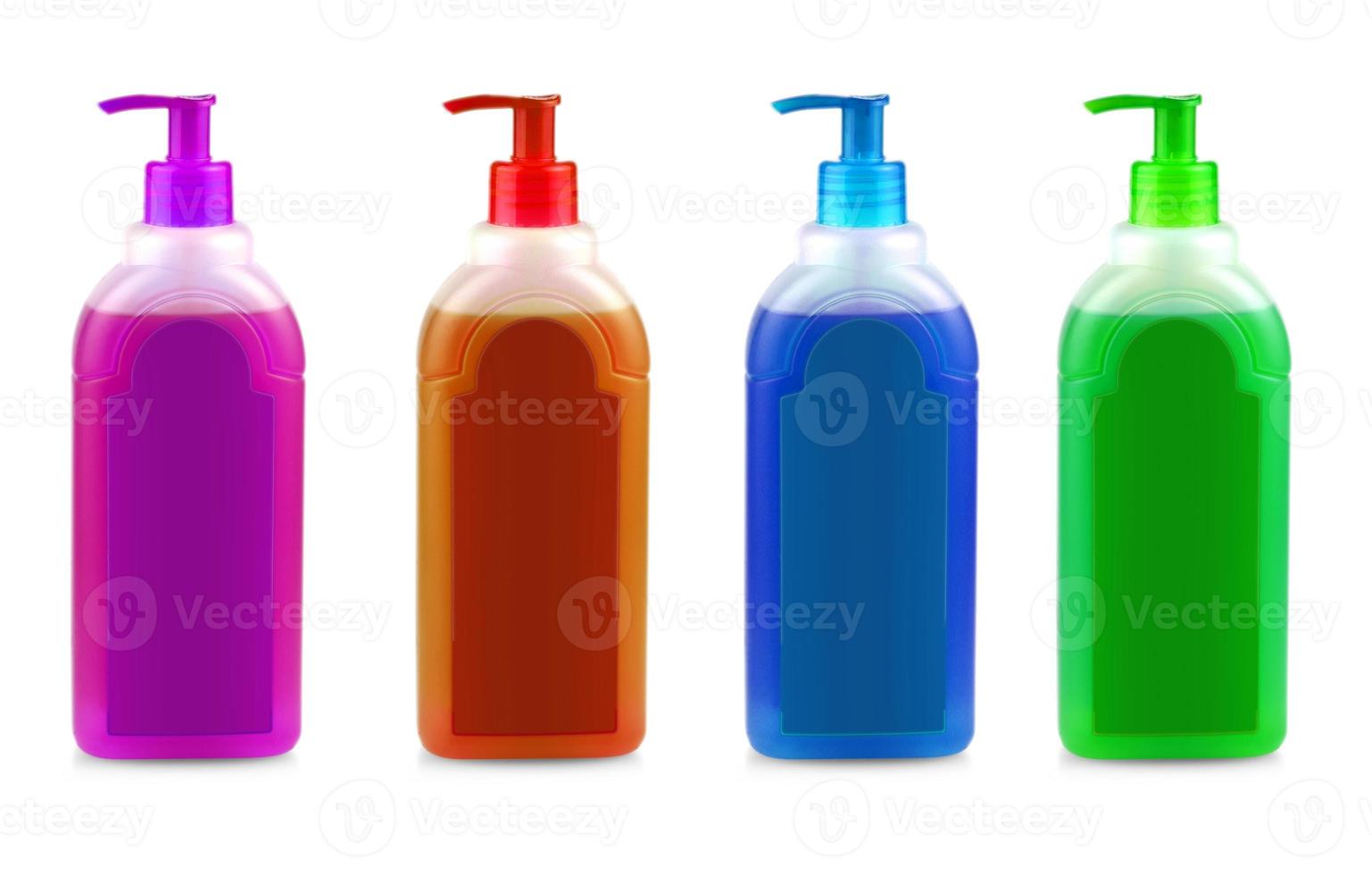 colored bottles with shampoo with dispenser on white background photo