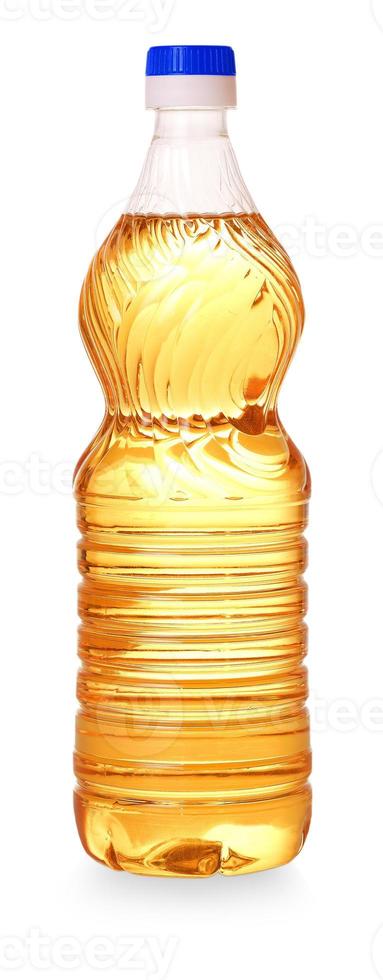 bottle with a yellow oil cut out on white background photo