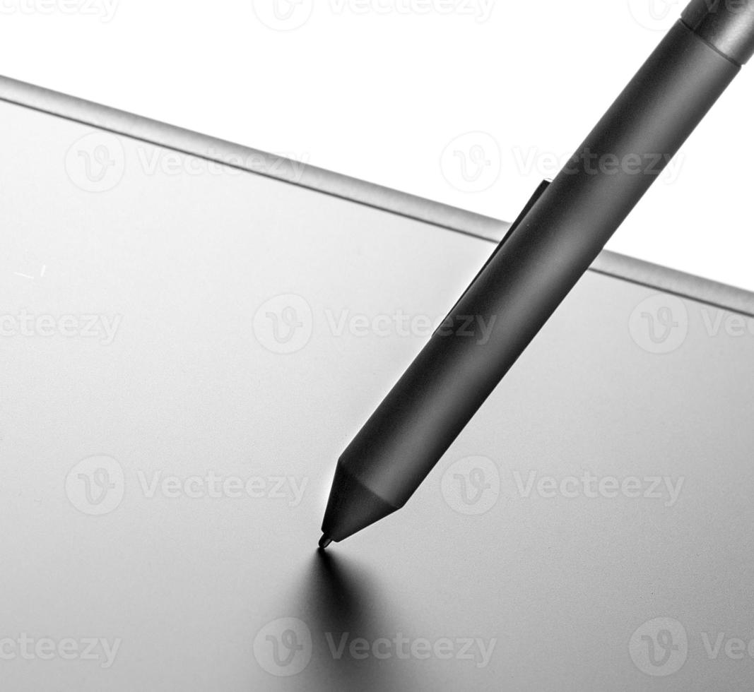The graphic tablet with the black pencil on white background photo