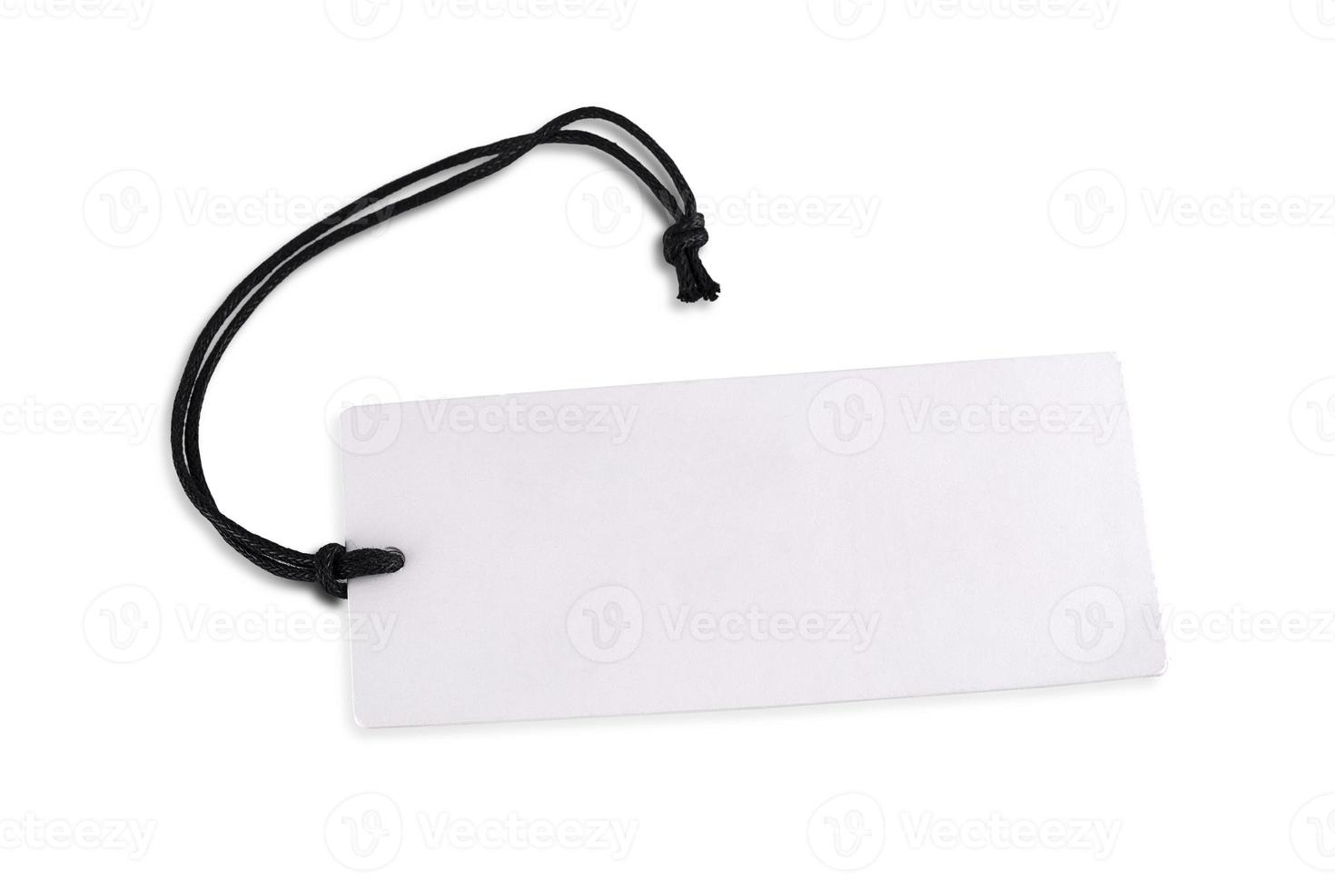 The blank white cardboard price tag or label isolated on white background. photo