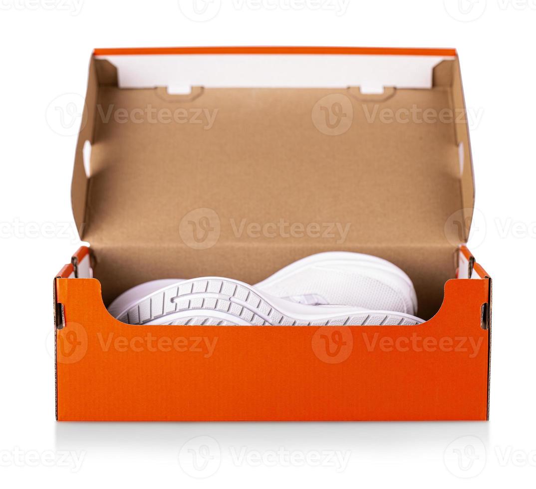 New white sneakers shoes in red box. photo