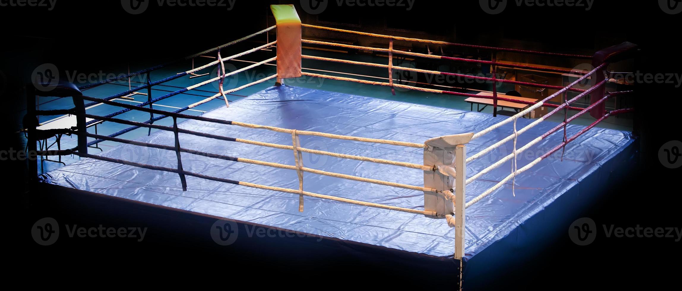 modern Professional boxing ring illuminated in the middle photo