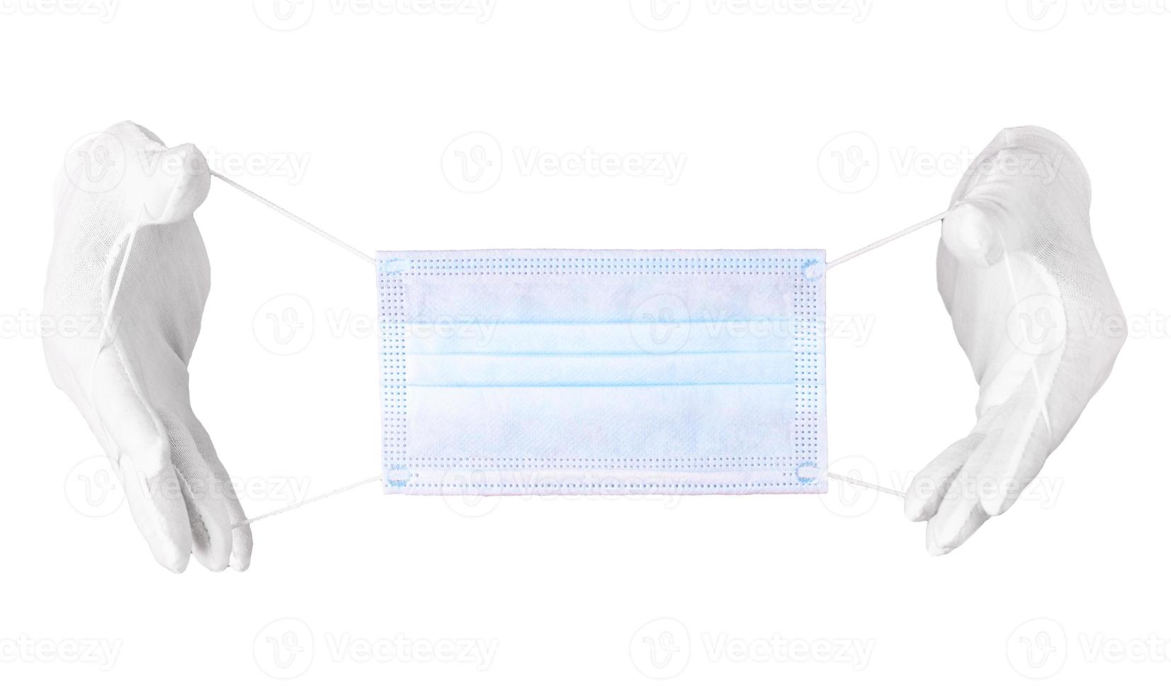 pair of thin gloves and face shield on a white background photo