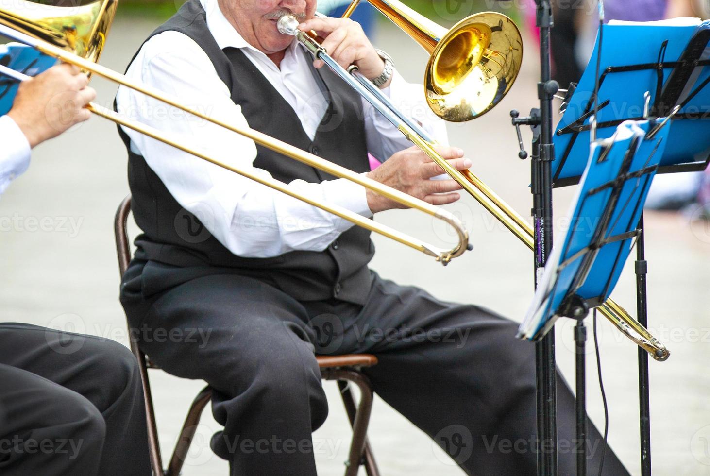 Selective focus. Musicians playing in outerwear on the street photo