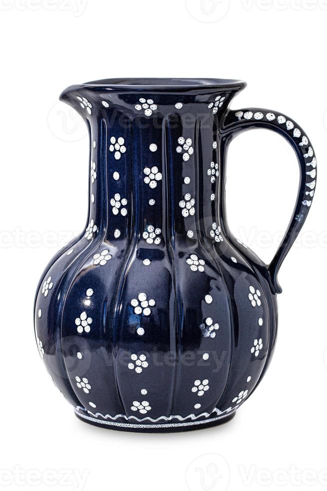 Blue antique pottery pitcher isolated on white background photo
