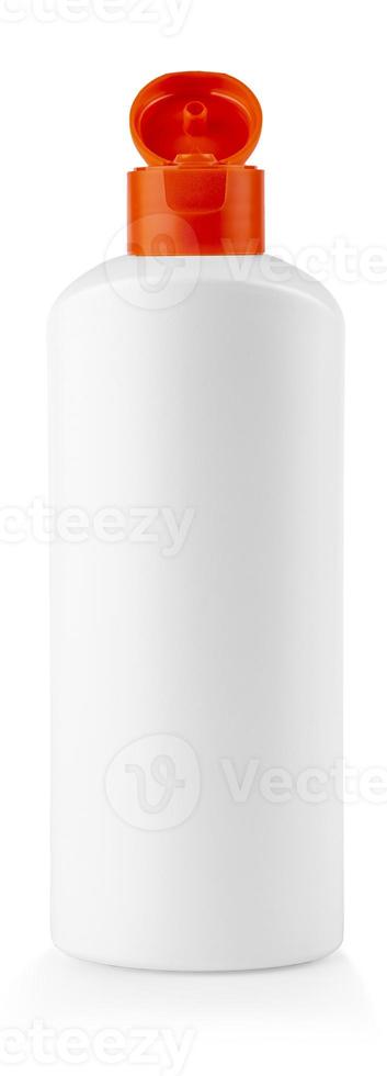 white plastic bottle with red cover with shampoo on white background photo