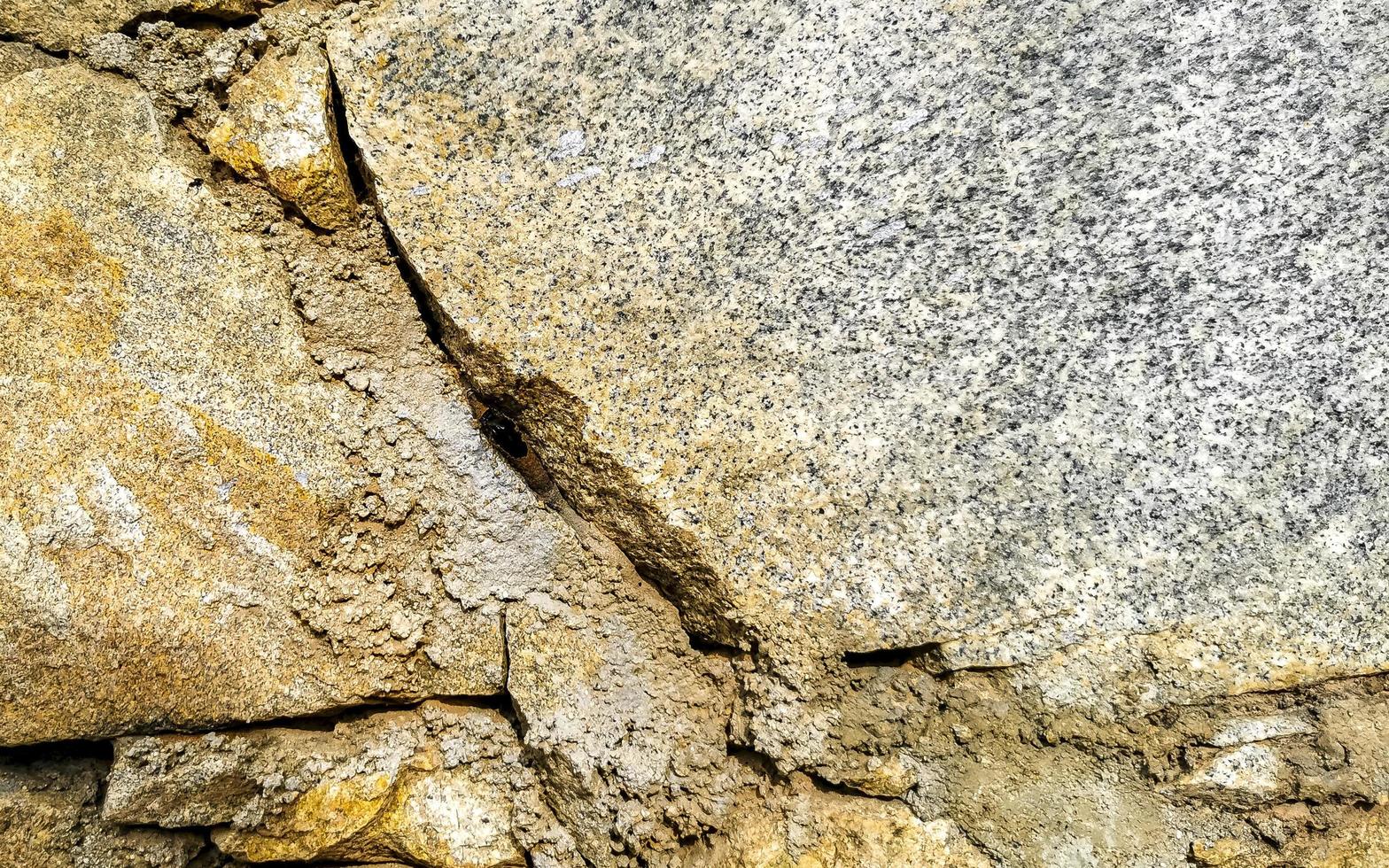 Rough stone and brick wall texture pattern Puerto Escondido Mexico. photo